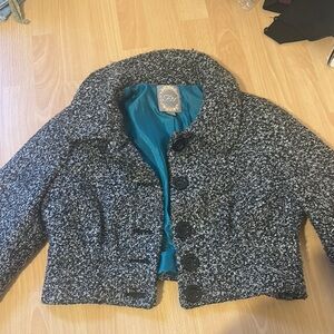 First like a small peacoat with button up cropped